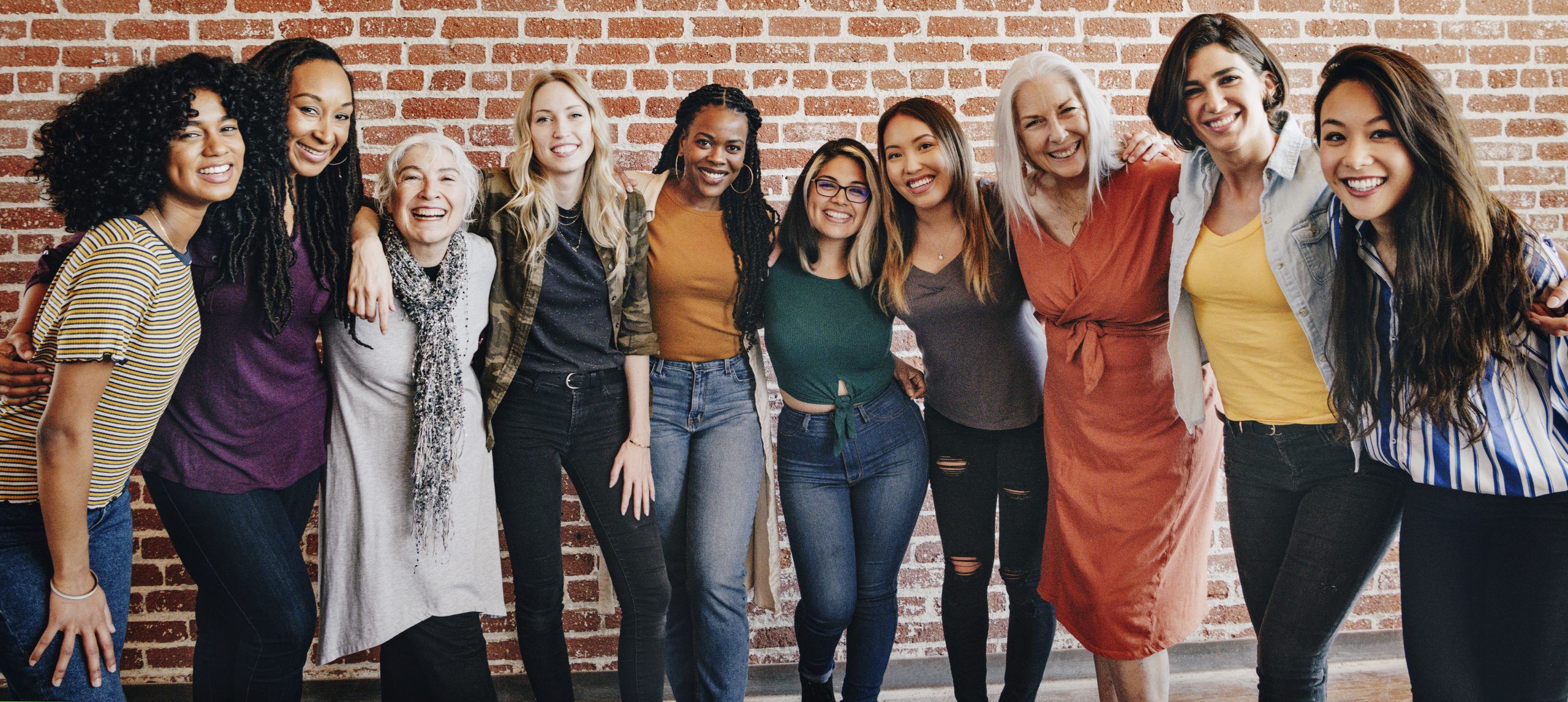 cheerful diverse women standing together